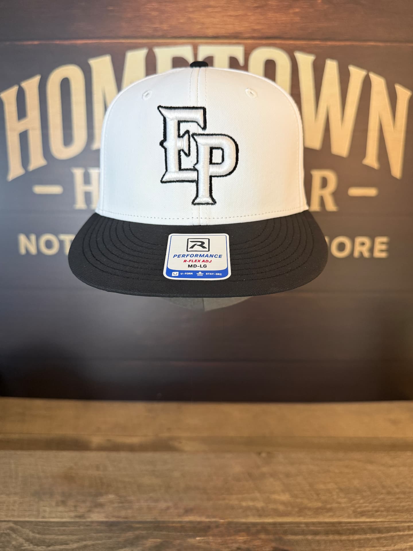White and black flat bill hat with EP monogram embroidery